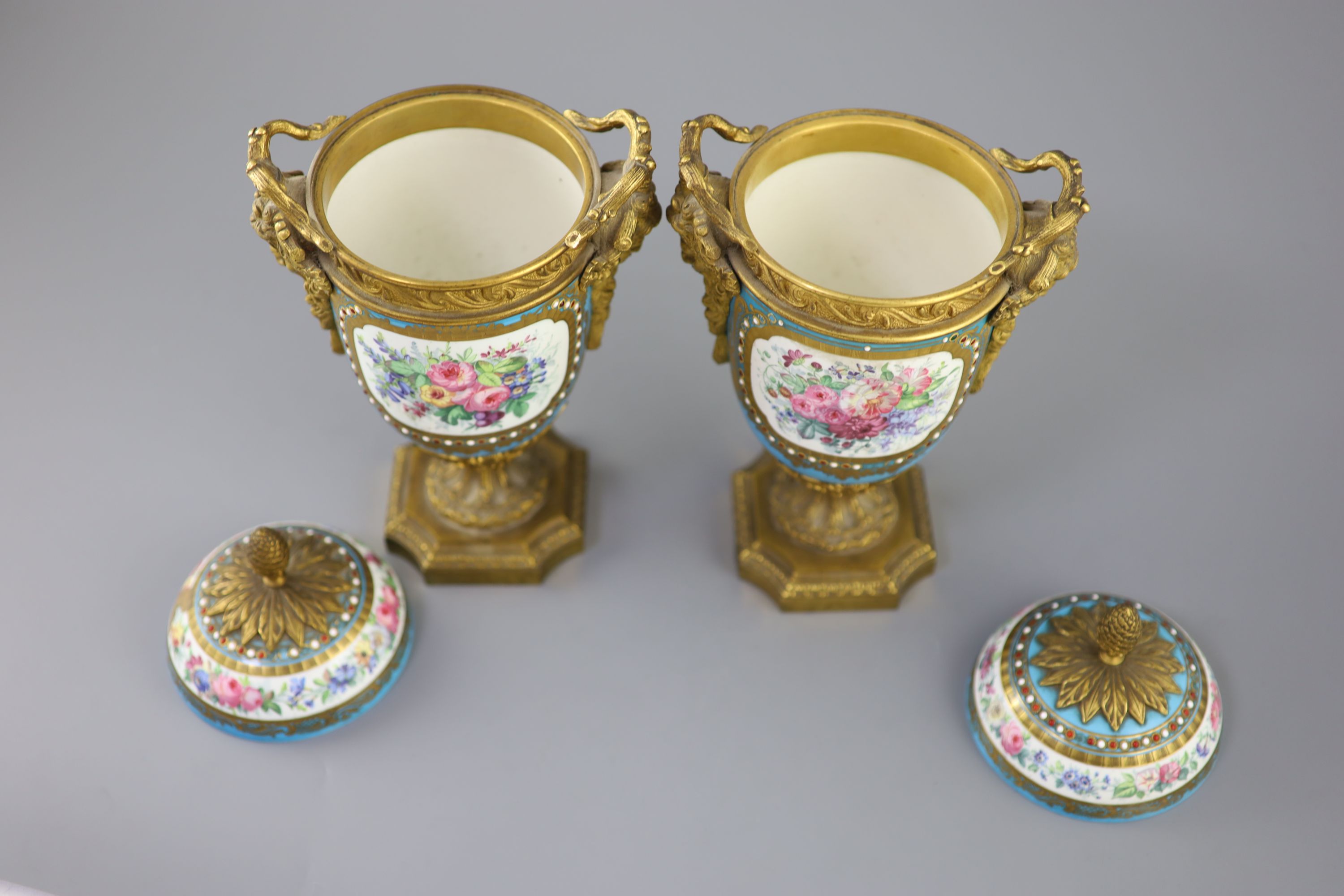 A pair of French Sevres style porcelain and ormolu mounted vases and covers, 19th century, 27cm high